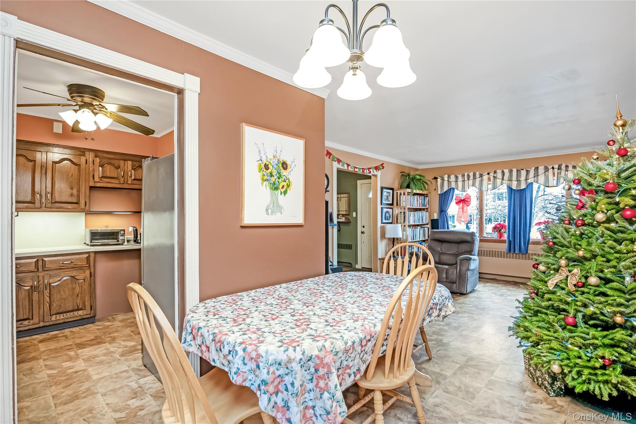 10 Roxbury Street Farmingdale, NY 11735 - Photo 9 of 25 a dining room filled with furniture and a chandelier