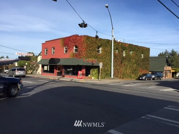 a view of a street with cars