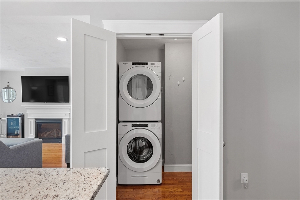 4 Scotch Pine Farm Way, Unit 1 Pepperell, MA 01463 - Photo 14 of 35 a view of a livingroom with washer and dryer