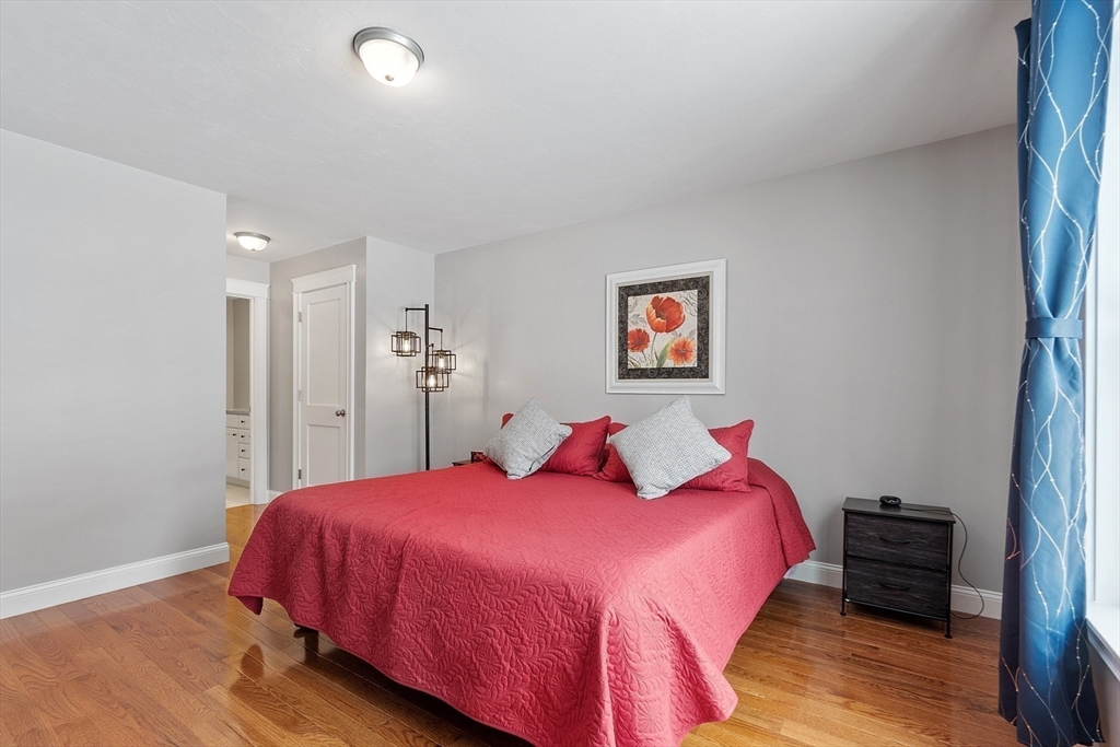 4 Scotch Pine Farm Way, Unit 1 Pepperell, MA 01463 - Photo 17 of 35 a bedroom with a bed and a closet