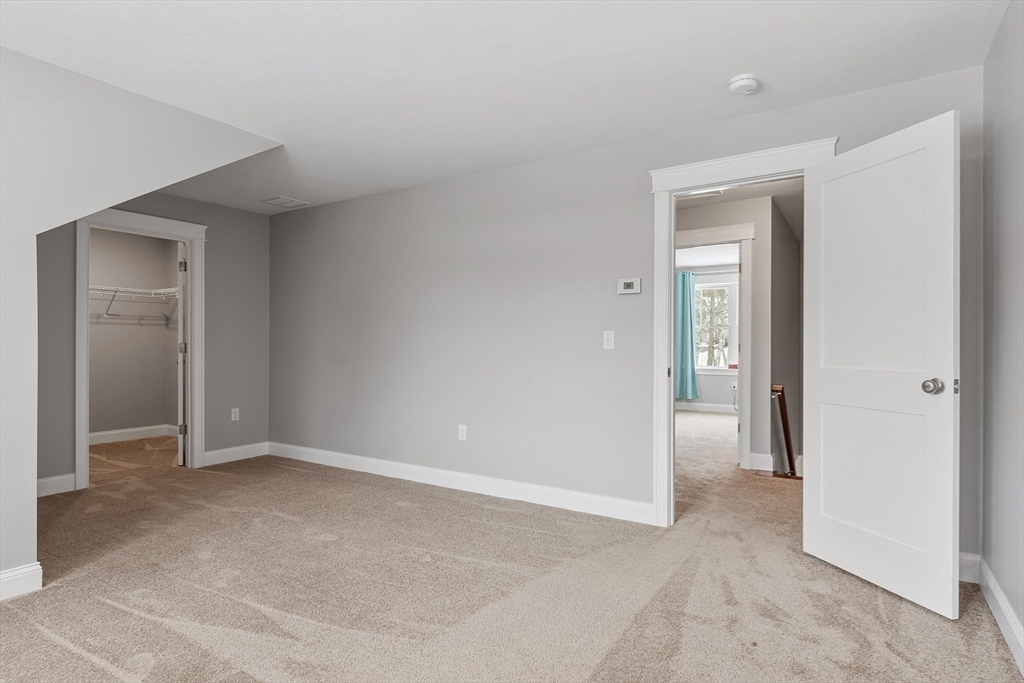 4 Scotch Pine Farm Way, Unit 1 Pepperell, MA 01463 - Photo 25 of 35 wooden floor and closet in a room
