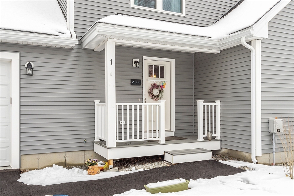4 Scotch Pine Farm Way, Unit 1 Pepperell, MA 01463 - Photo 31 of 35 a view of a house with a small porch