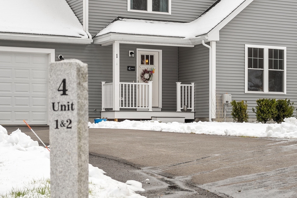 4 Scotch Pine Farm Way, Unit 1 Pepperell, MA 01463 - Photo 32 of 35 a front view of a house with a road