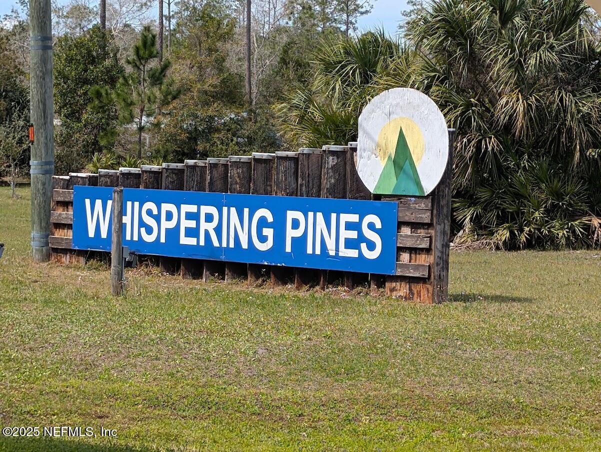 a view of outdoor space with sign board and garden