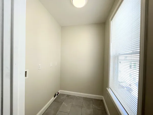 a view of a room that has a window in it