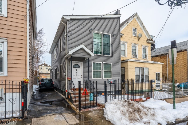 853 Rebecca Place Elizabeth, NJ 07201 - Photo 2 of 22 a view of a house with wooden fence