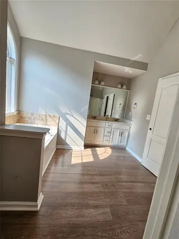 a view of entryway with wooden floor