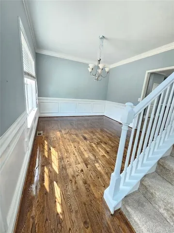 a view of a livingroom with wooden floor
