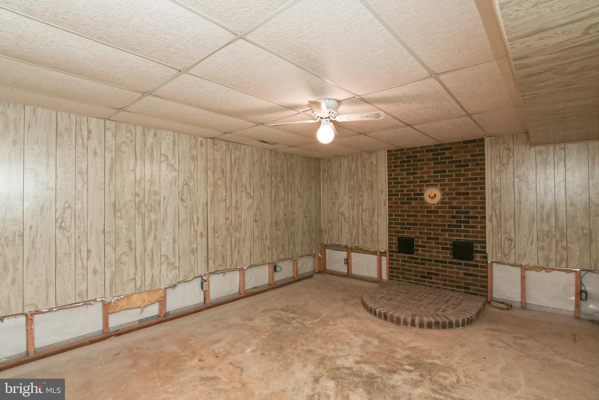 455 Courthouse Road Stafford, VA 22554 - Photo 43 of 62 Room to left of storage room with brick hearth