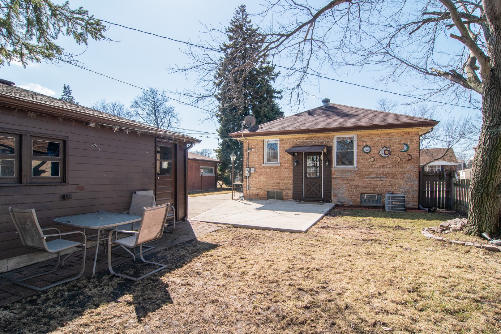 309 High Ridge Road Hillside, IL 60162 - Photo 12 of 13 a house with a bench in front of it