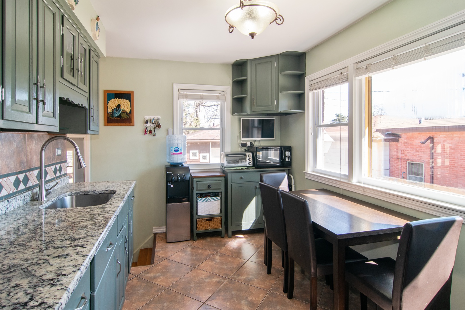 309 High Ridge Road Hillside, IL 60162 - Photo 3 of 13 a kitchen with cabinets appliances and a counter top