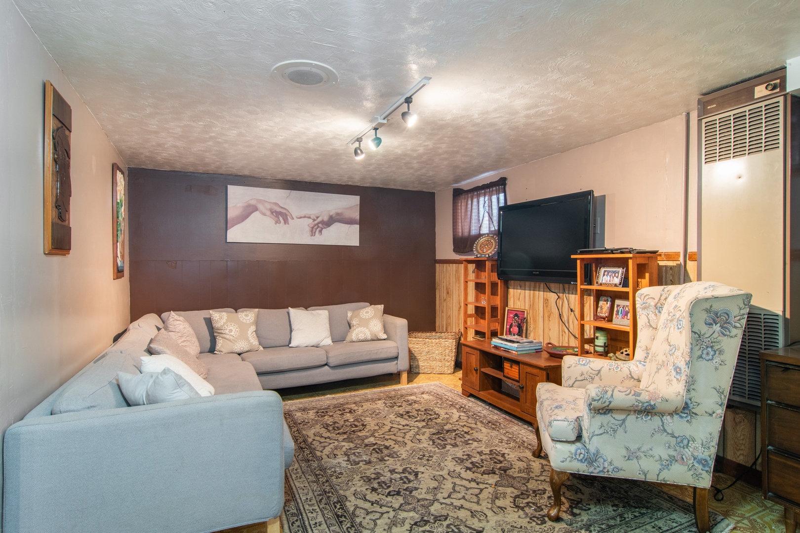 309 High Ridge Road Hillside, IL 60162 - Photo 8 of 13 a living room with furniture and a flat screen tv