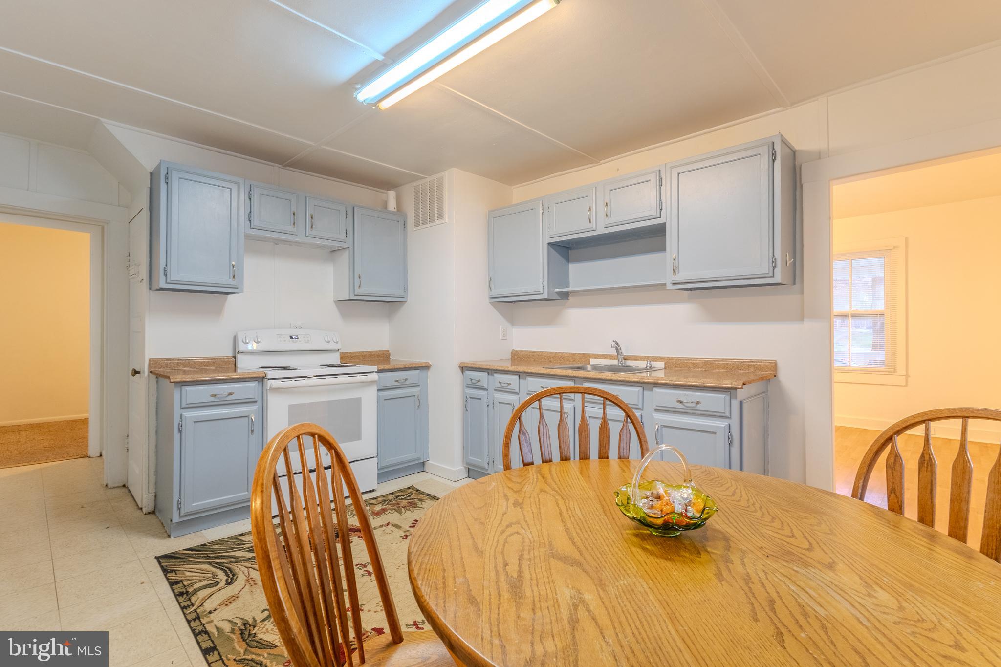 1168 Mt Zion Marlboro Road Lothian, MD 20711 - Photo 11 of 26 a bedroom with a bed and a table