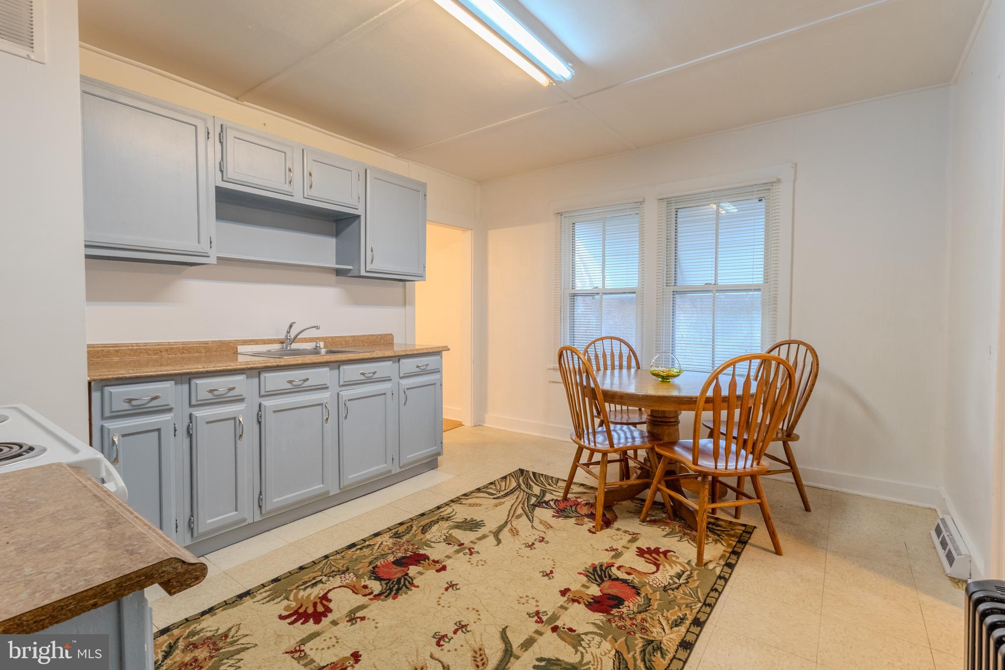 1168 Mt Zion Marlboro Road Lothian, MD 20711 - Photo 12 of 26 a dining room with furniture and wooden floor