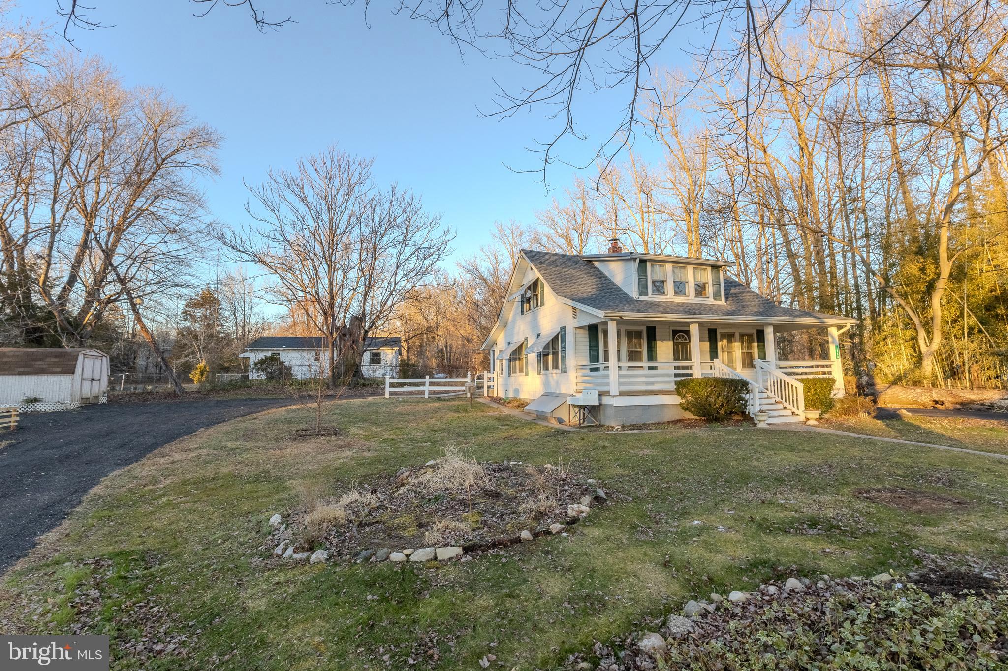1168 Mt Zion Marlboro Road Lothian, MD 20711 - Photo 3 of 26 a front view of a house with a yard and garage