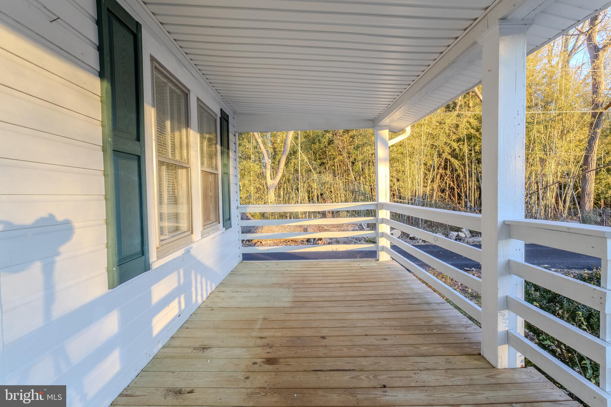 1168 Mt Zion Marlboro Road Lothian, MD 20711 - Photo 6 of 26 a view of a large room with wooden floor and windows