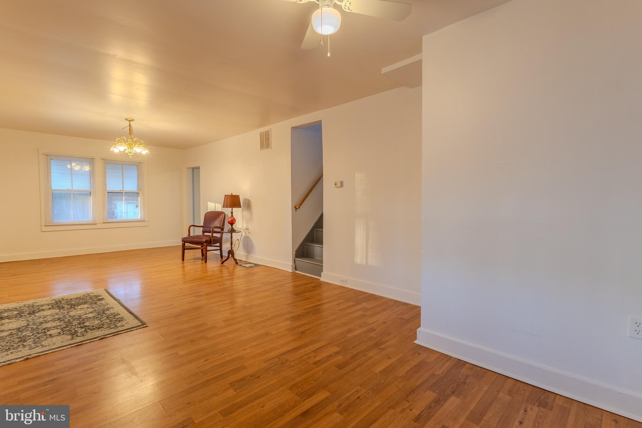 1168 Mt Zion Marlboro Road Lothian, MD 20711 - Photo 8 of 26 a view of an empty room with wooden floor and a window