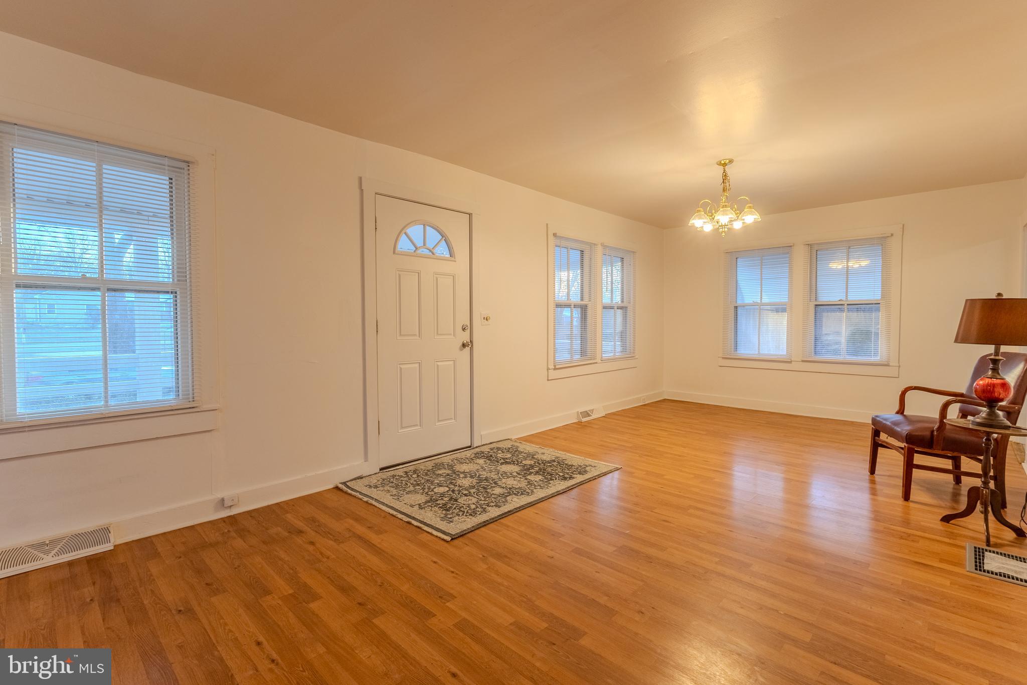 1168 Mt Zion Marlboro Road Lothian, MD 20711 - Photo 9 of 26 a view of an empty room with window and wooden floor