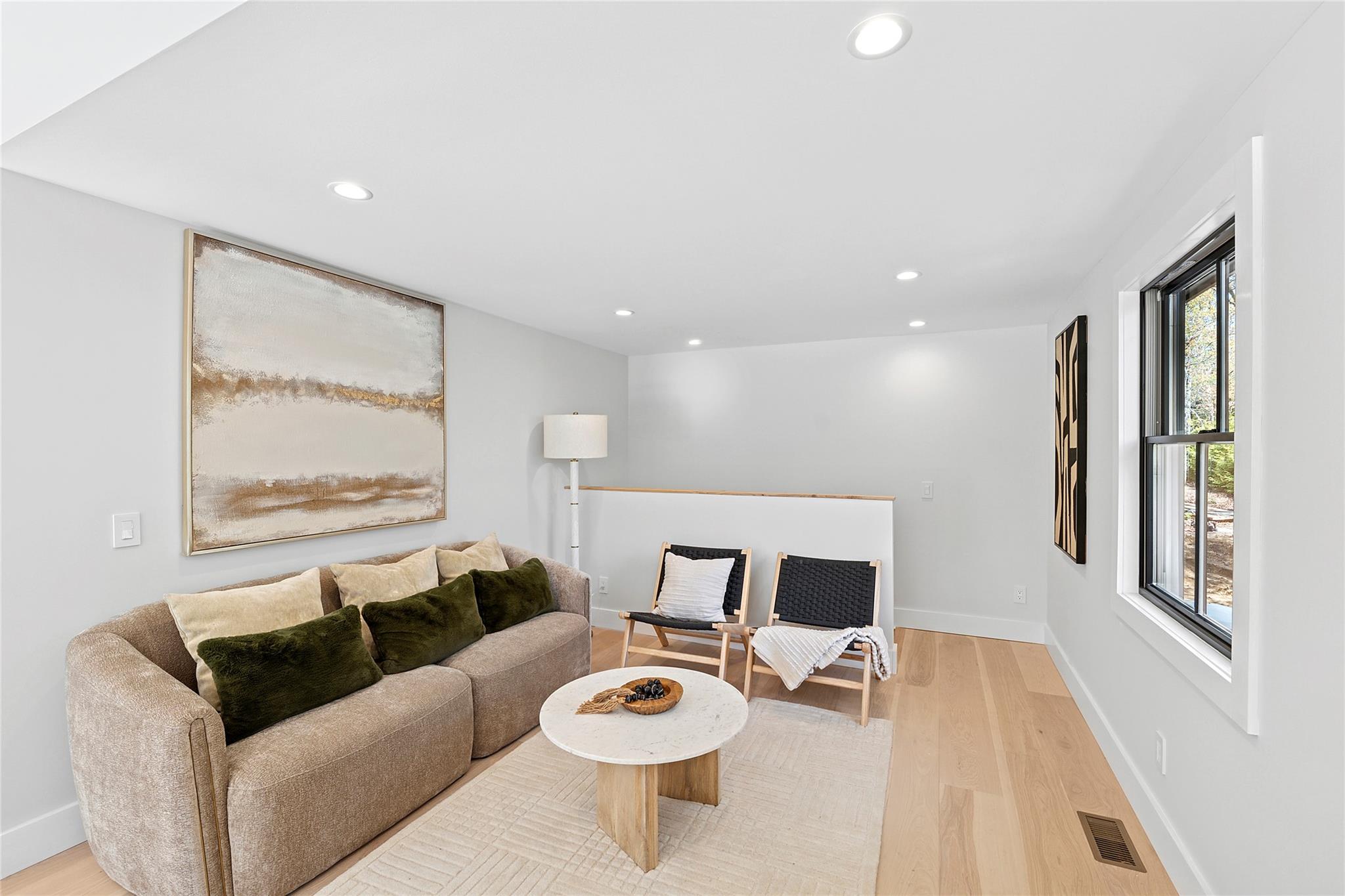 20 Boatheaders Lane North East Hampton, NY 11937 - Photo 6 of 15 a living room with furniture and a large window