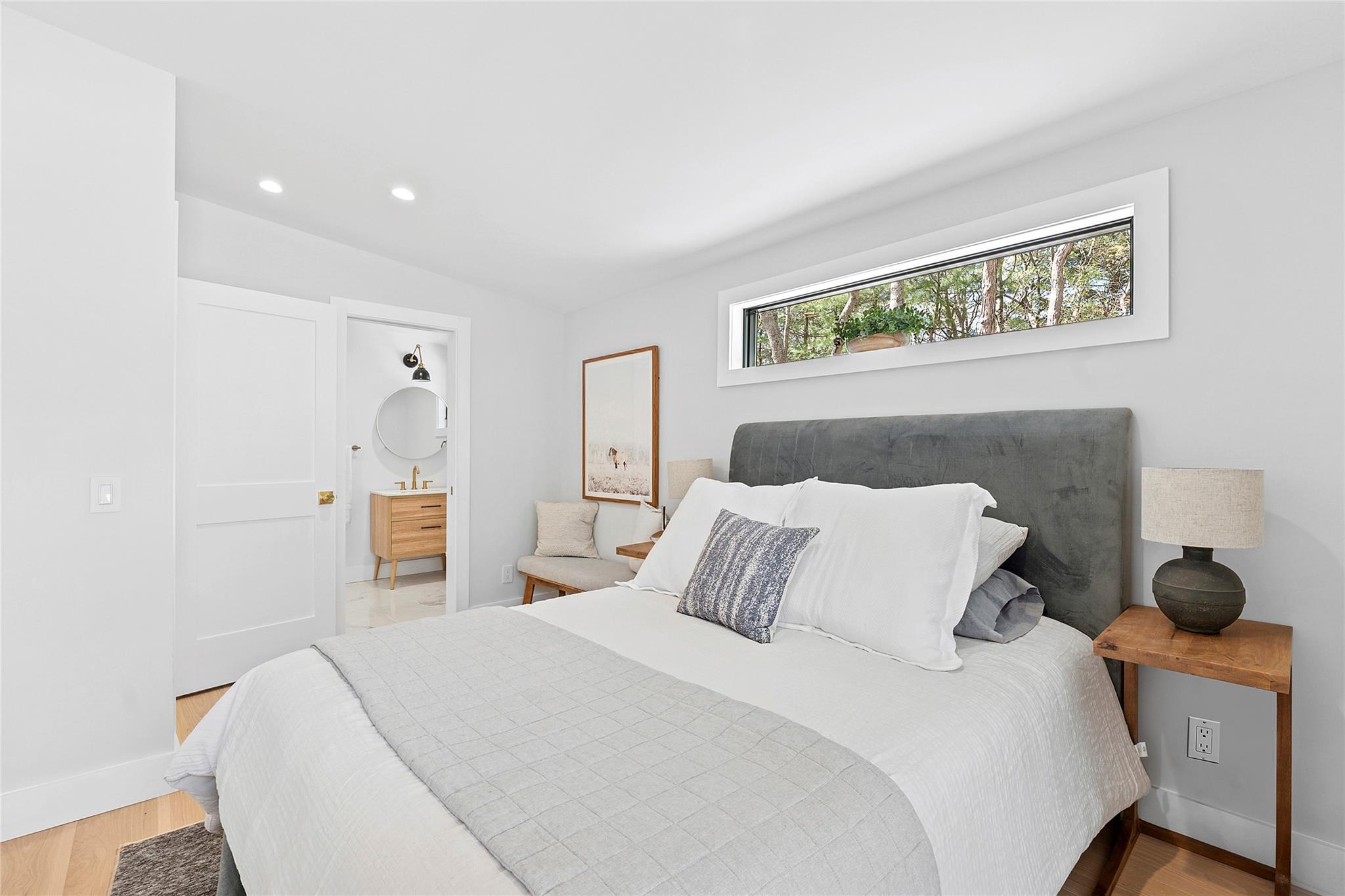 20 Boatheaders Lane North East Hampton, NY 11937 - Photo 7 of 15 a bedroom with a bed and a painting on the wall