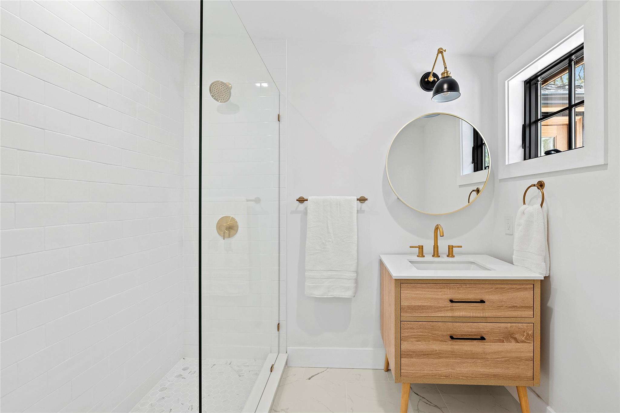 20 Boatheaders Lane North East Hampton, NY 11937 - Photo 8 of 15 a bathroom with a sink vanity and a mirror