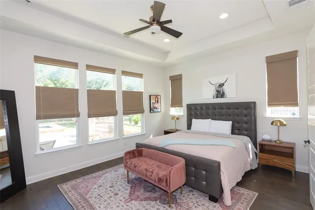 a bedroom with a bed and a chandelier