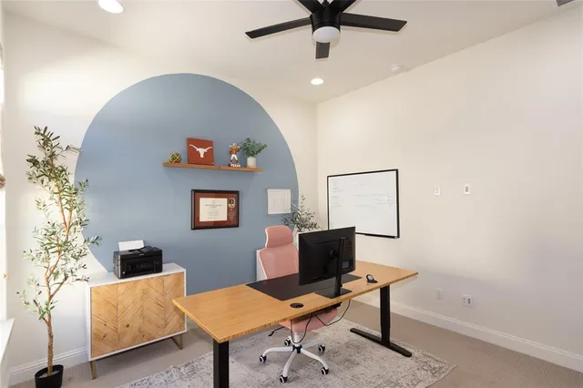 a bathroom with a double vanity sink a large mirror and a bathtub