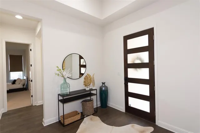 a living room with a bed furniture and a window