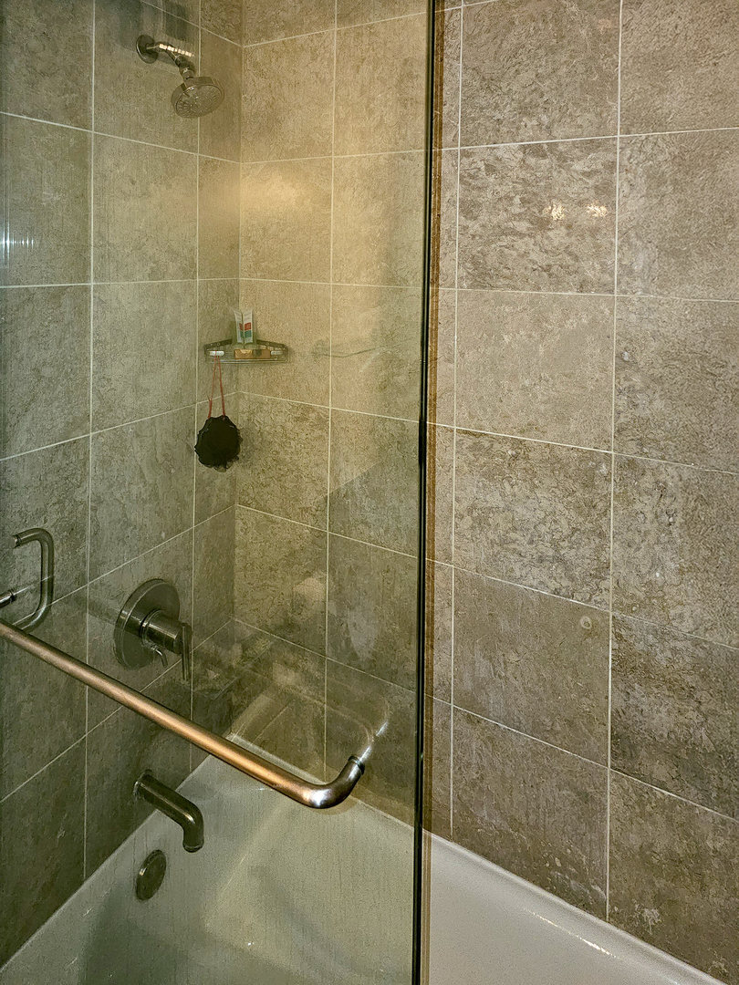 405 North Wabash Avenue, Unit 2613 Chicago, IL 60611 - Photo 15 of 24 a bathroom with a shower and a sink