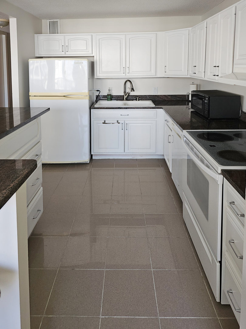 405 North Wabash Avenue, Unit 2613 Chicago, IL 60611 - Photo 6 of 24 a kitchen with a sink a stove and cabinets