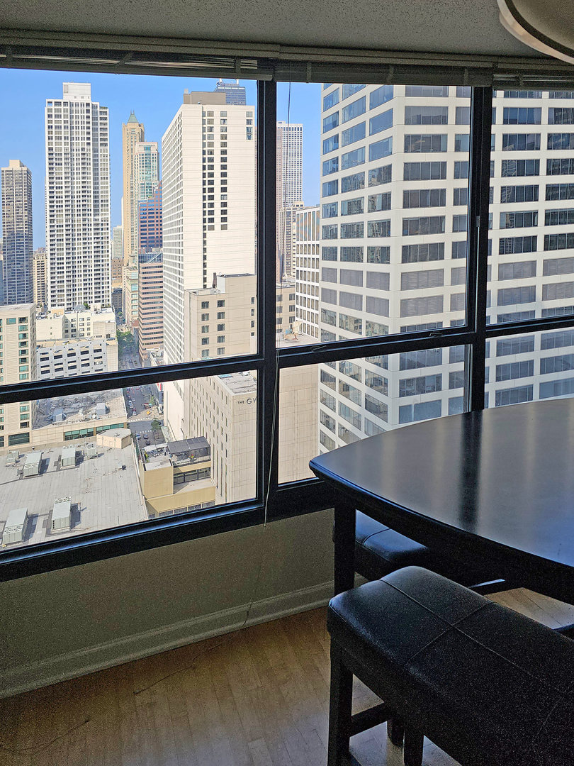 405 North Wabash Avenue, Unit 2613 Chicago, IL 60611 - Photo 8 of 24 a view of a room with furniture and window