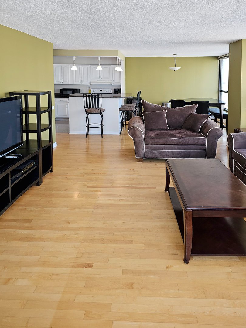 405 North Wabash Avenue, Unit 2613 Chicago, IL 60611 - Photo 10 of 24 a living room with furniture and kitchen view