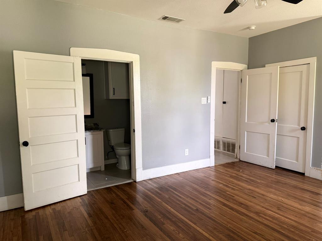 202 4th Street Joshua, TX 76058 - Photo 15 of 39 an empty room with wooden floor and closet