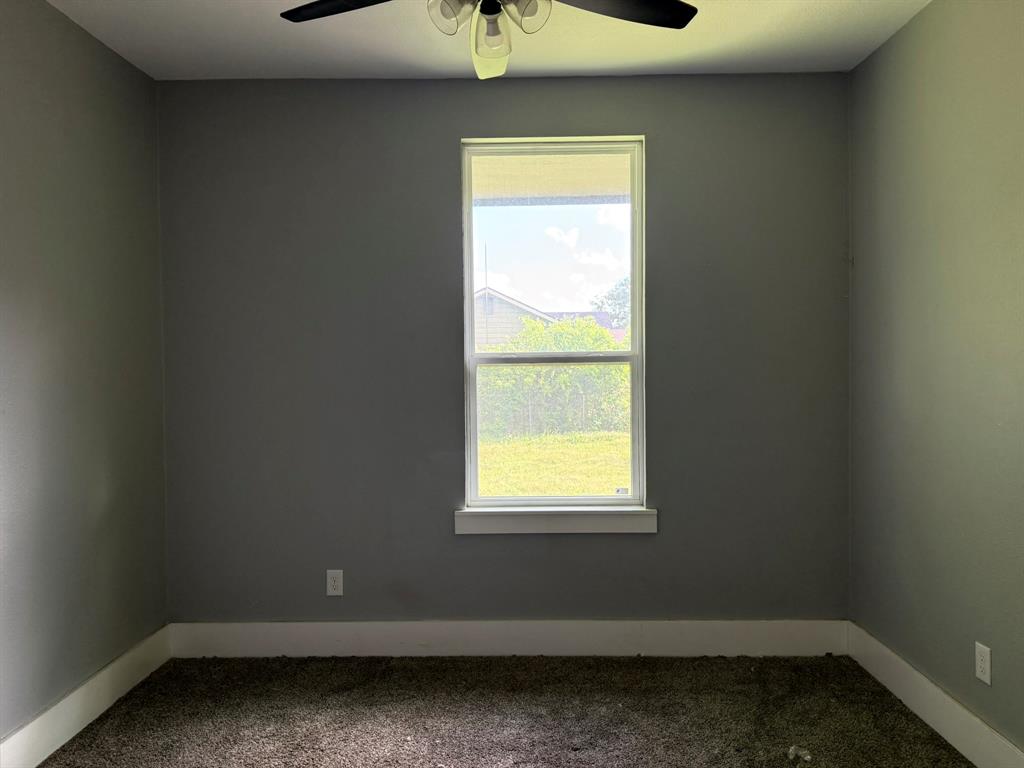 202 4th Street Joshua, TX 76058 - Photo 17 of 39 an empty room with a window