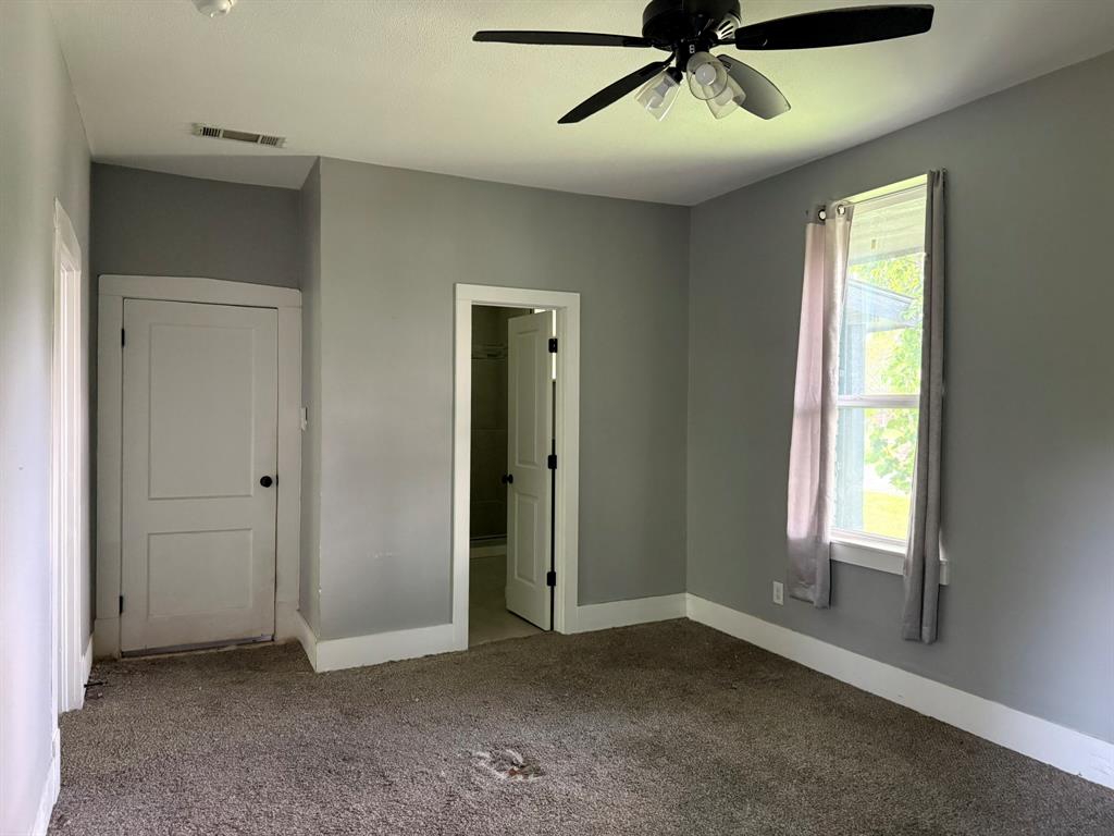 202 4th Street Joshua, TX 76058 - Photo 21 of 39 a view of an empty room with a window