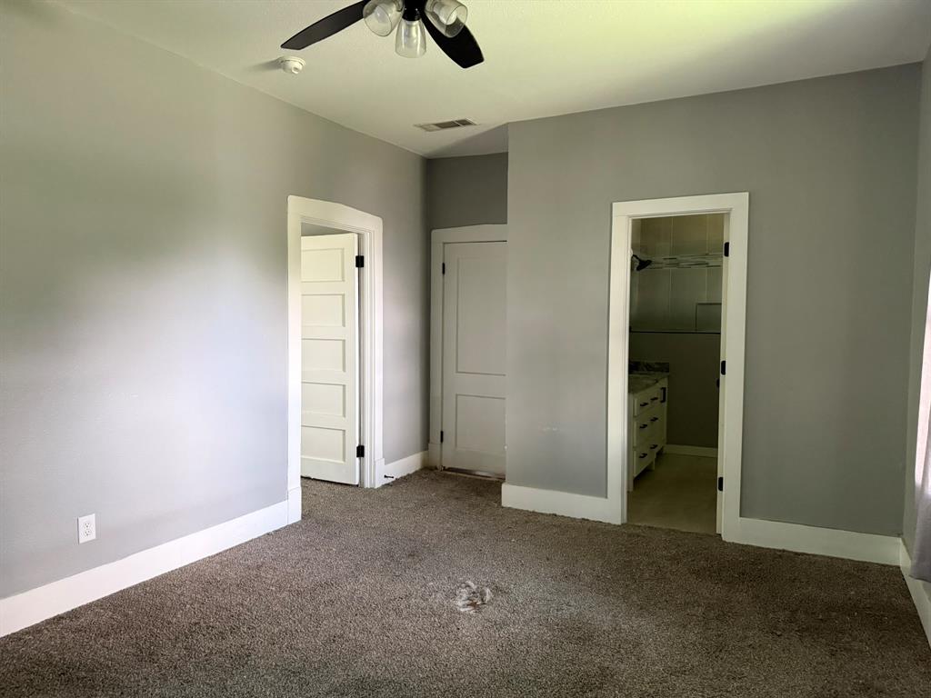 202 4th Street Joshua, TX 76058 - Photo 22 of 39 an empty room with ceiling fan and window