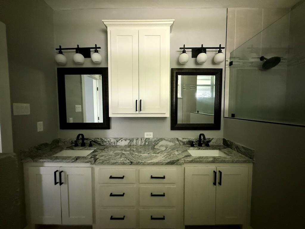 202 4th Street Joshua, TX 76058 - Photo 24 of 39 a bathroom with a sink and a mirror