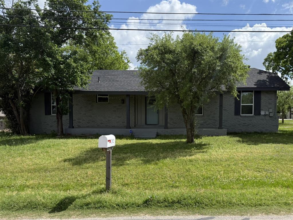 202 4th Street Joshua, TX 76058 - Photo 32 of 39 a front view of a house with a yard