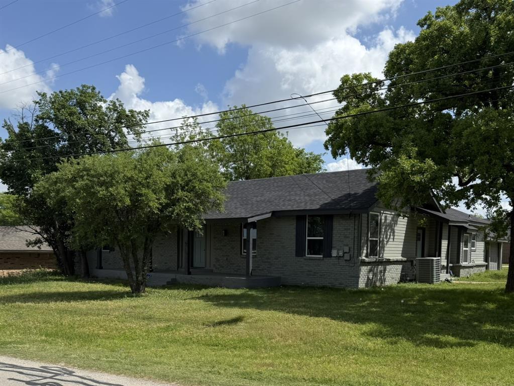 202 4th Street Joshua, TX 76058 - Photo 33 of 39 a front view of a house with a garden
