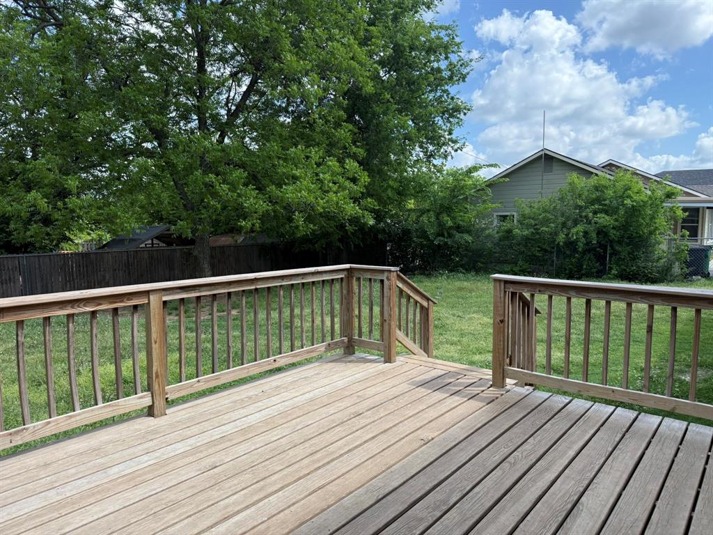 202 4th Street Joshua, TX 76058 - Photo 38 of 39 a balcony with wooden floor and fence
