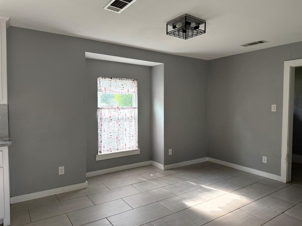 202 4th Street Joshua, TX 76058 - Photo 8 of 39 a view of an empty room with a window