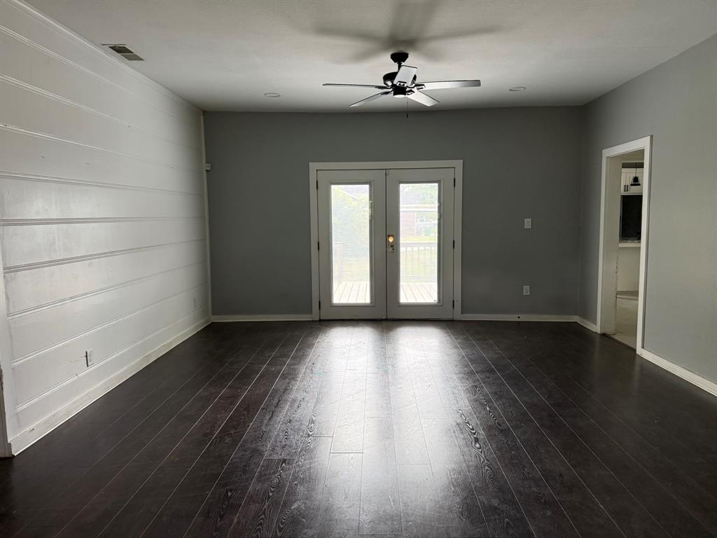 202 4th Street Joshua, TX 76058 - Photo 9 of 39 wooden floor in an empty room with a window