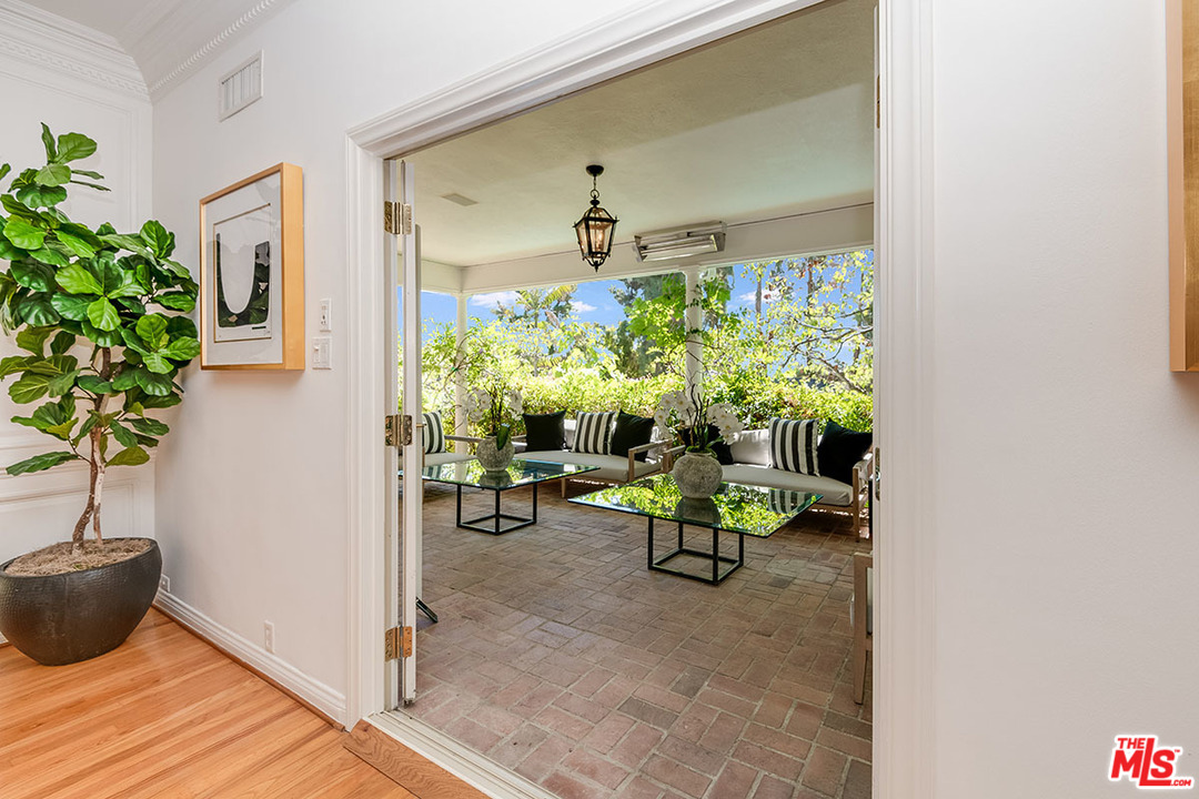 11610 Bellagio Road Los Angeles, CA 90049 - Photo 11 of 46 a view of living room filled with furniture and a potted plant