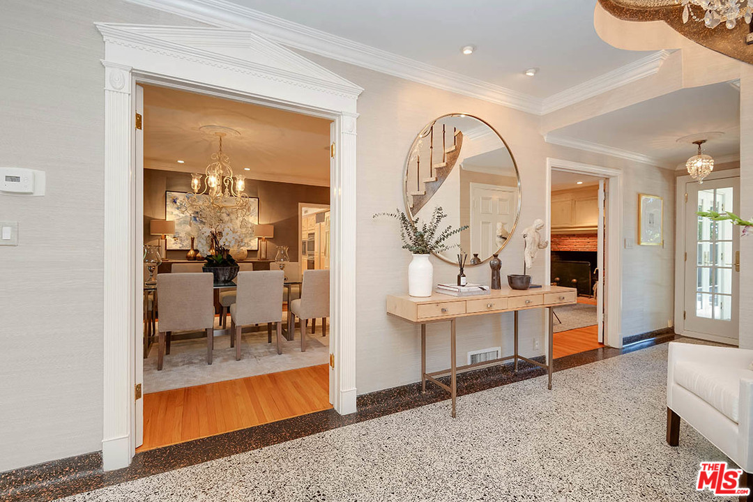 11610 Bellagio Road Los Angeles, CA 90049 - Photo 13 of 46 a view of living room and kitchen with furniture