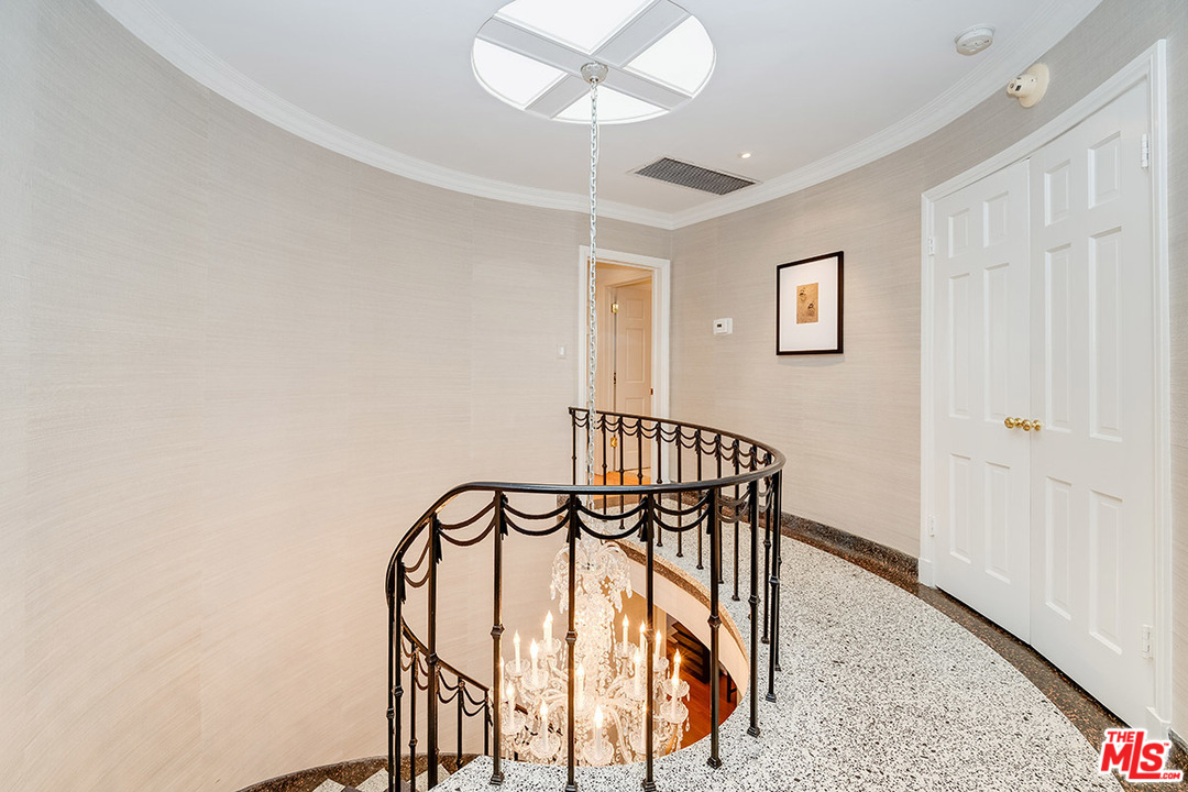 11610 Bellagio Road Los Angeles, CA 90049 - Photo 25 of 46 a view of entryway and hall with a front door