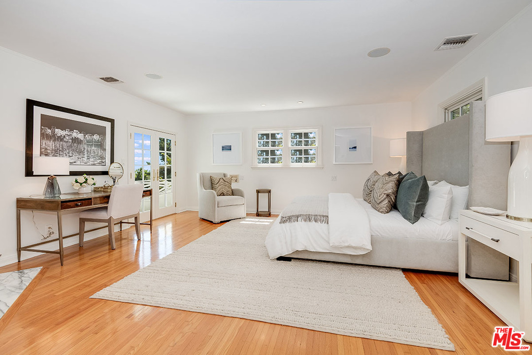 11610 Bellagio Road Los Angeles, CA 90049 - Photo 26 of 46 a living room with furniture and a table
