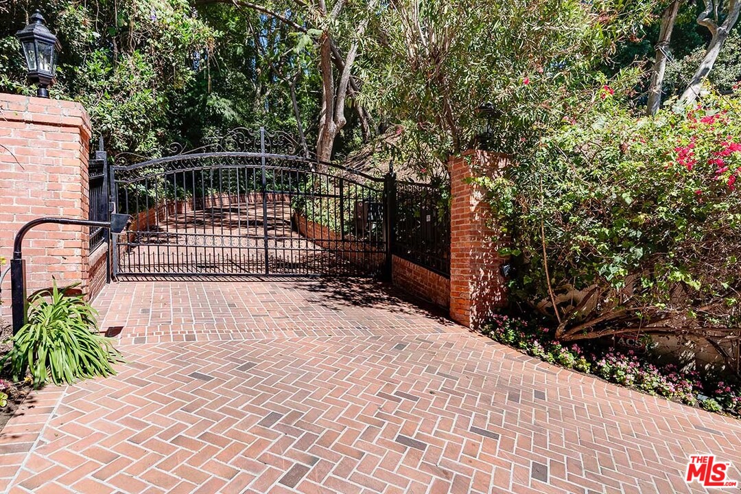 11610 Bellagio Road Los Angeles, CA 90049 - Photo 4 of 46 a view of backyard with deck and patio