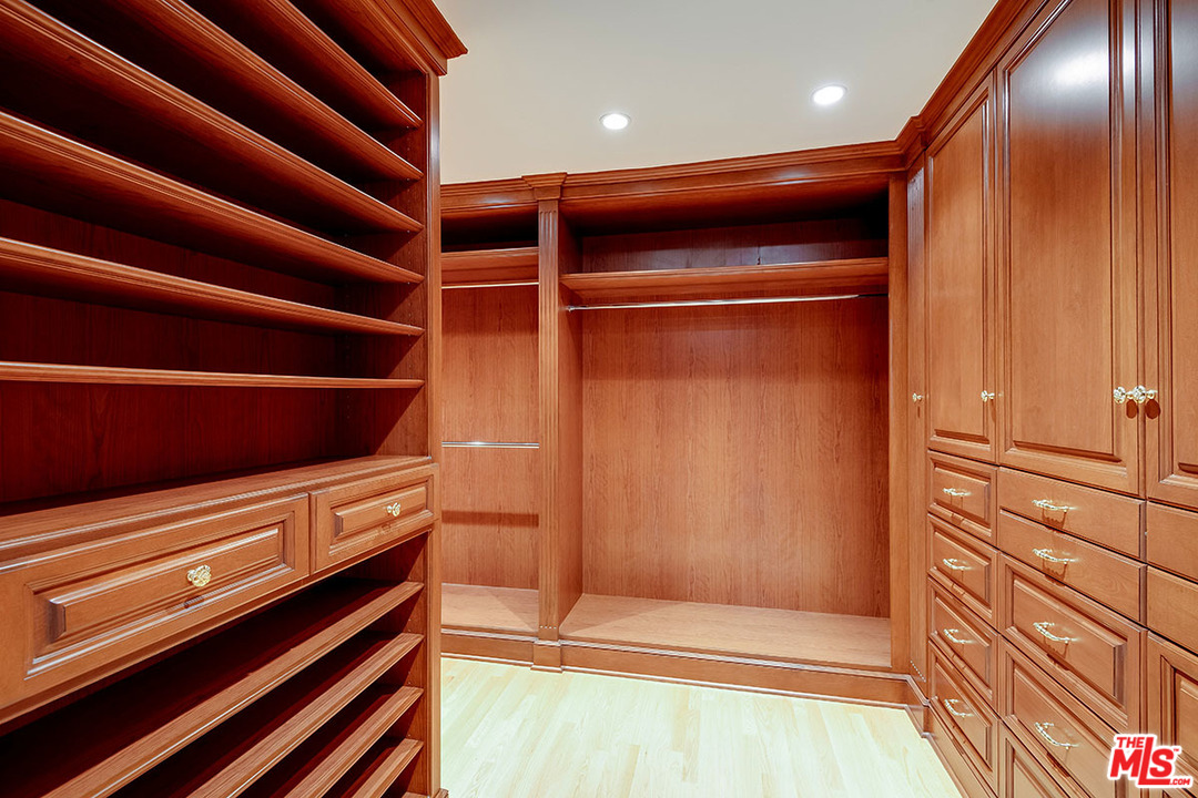 11610 Bellagio Road Los Angeles, CA 90049 - Photo 31 of 46 a view of an empty room with wooden walls