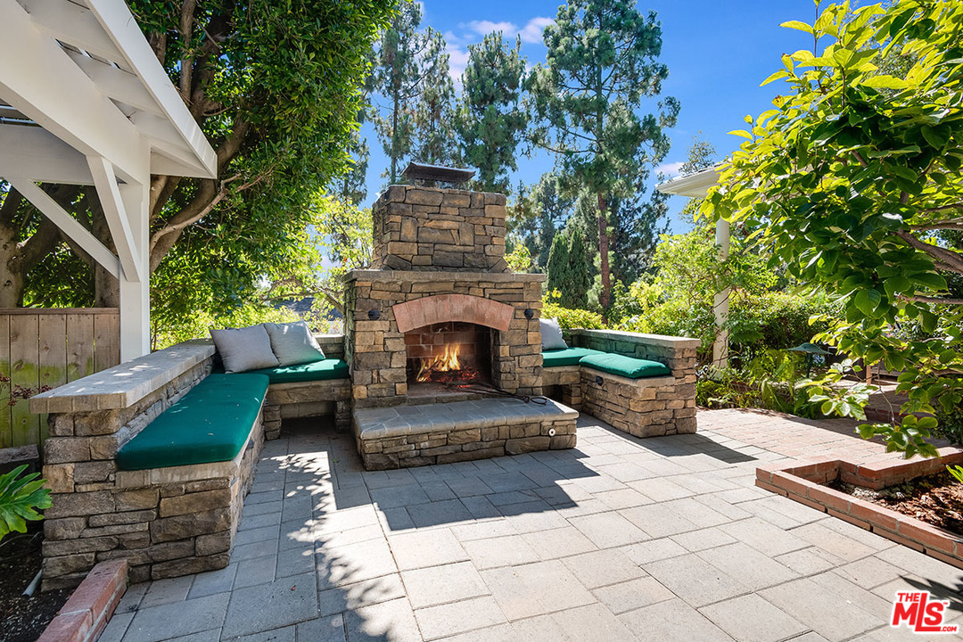 11610 Bellagio Road Los Angeles, CA 90049 - Photo 38 of 46 a view of house with outdoor seating and entertaining space
