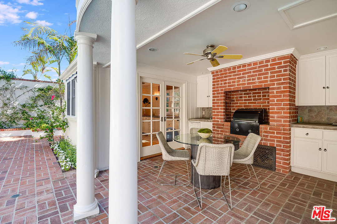 11610 Bellagio Road Los Angeles, CA 90049 - Photo 41 of 46 a view of a house with backyard and sitting area